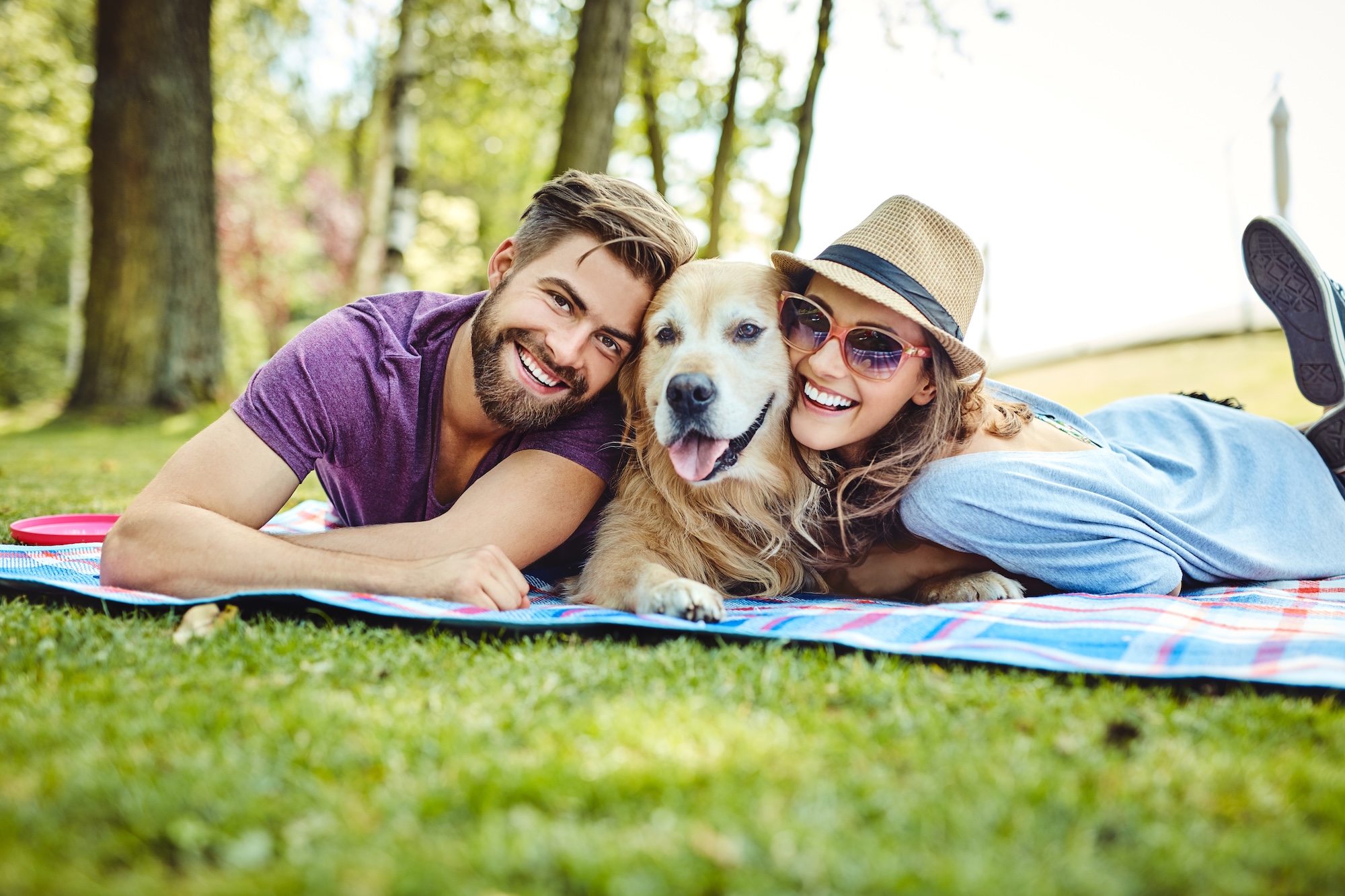 Young couple having picnic at Lady Bird Lake in Austin 